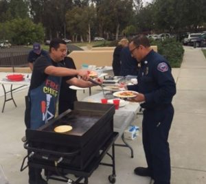 Fire Chief David Endaya serving up breakfast for National EMS Week.