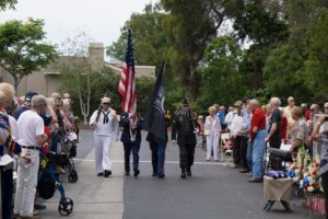 A military Color Guard from the 1st Memorial Honors Detail, representing the different branches of the military, present arms at a previous Salute To Our Veterans event at Cypress Place Senior Living in Ventura. Photo by Michael Gordon