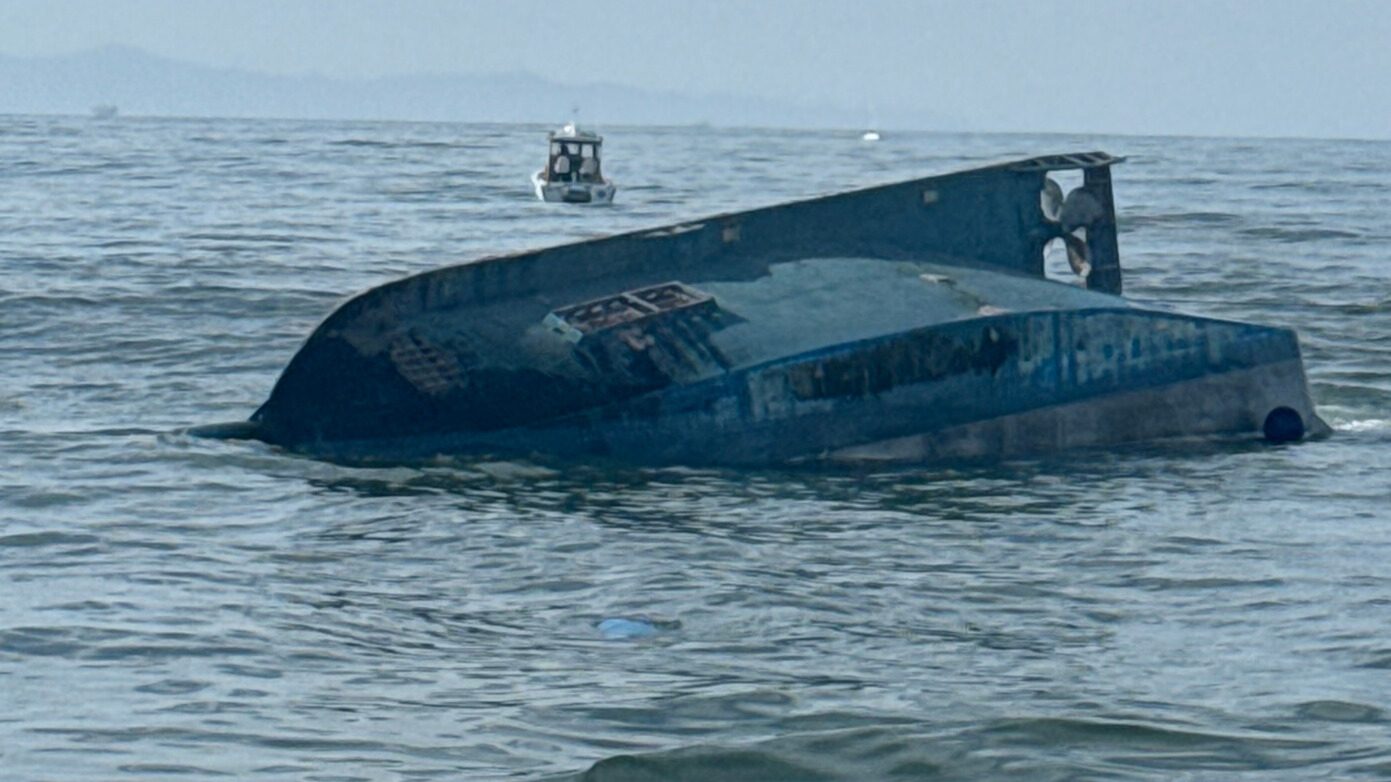 Capsized Fishing Boat in Water