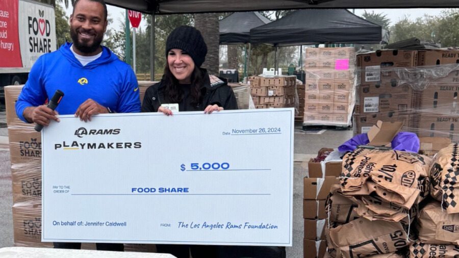 Jennifer Caldwell, Chief Development Officer at Food Share, accepts a generous $5,000 donation from Noel Grigsby Jr., LA Rams Social Justice and Football Development Representative.