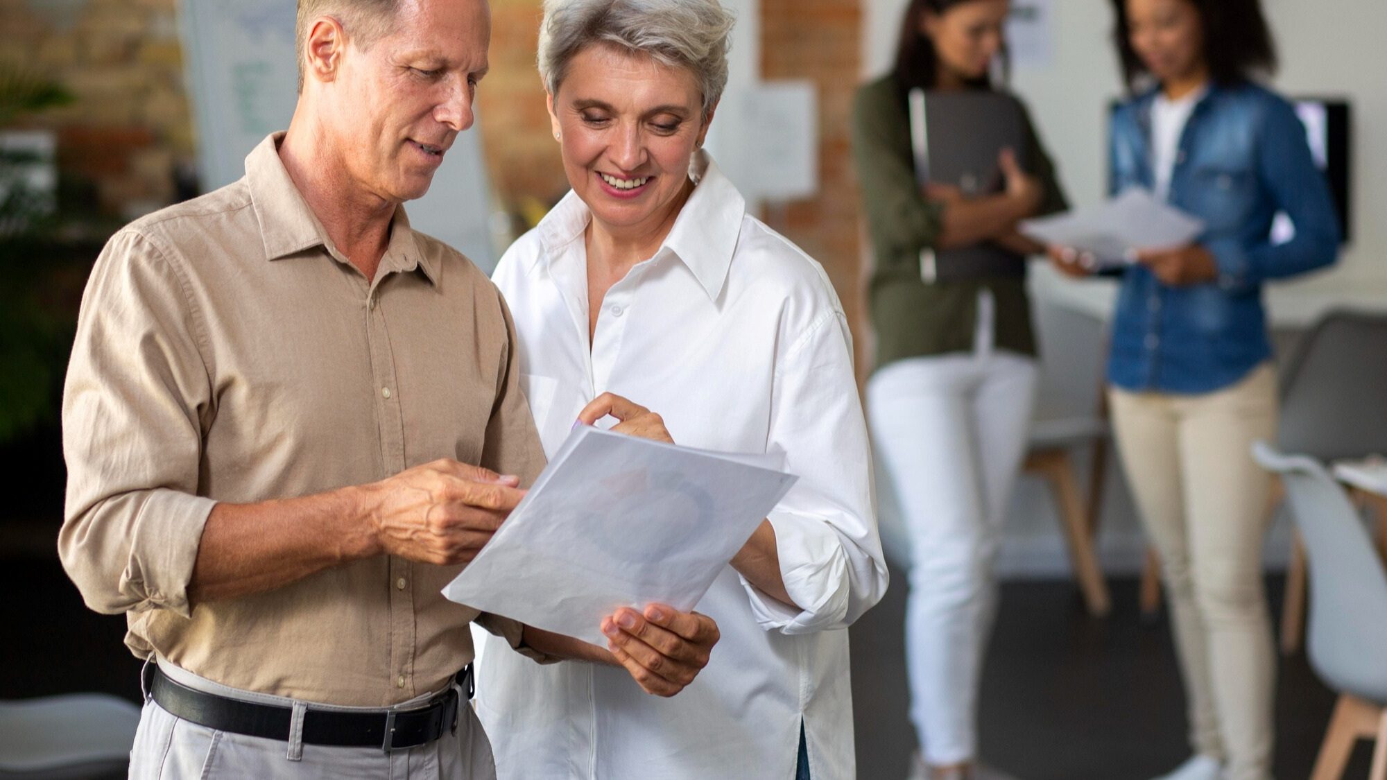 Photo of man and woman speaking.