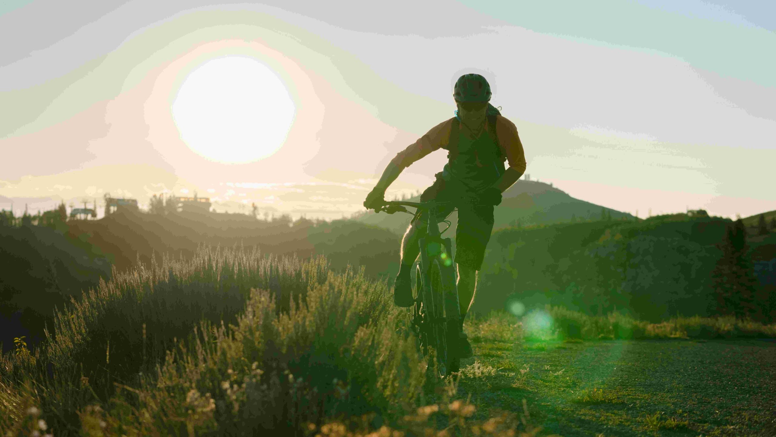 Person riding bike in hills