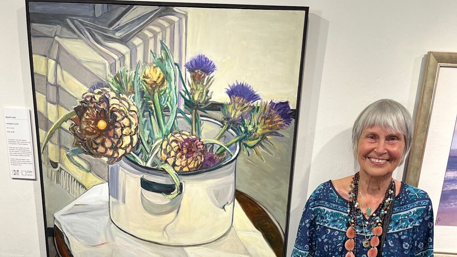 Artist Karen Lewis with one of her paintings