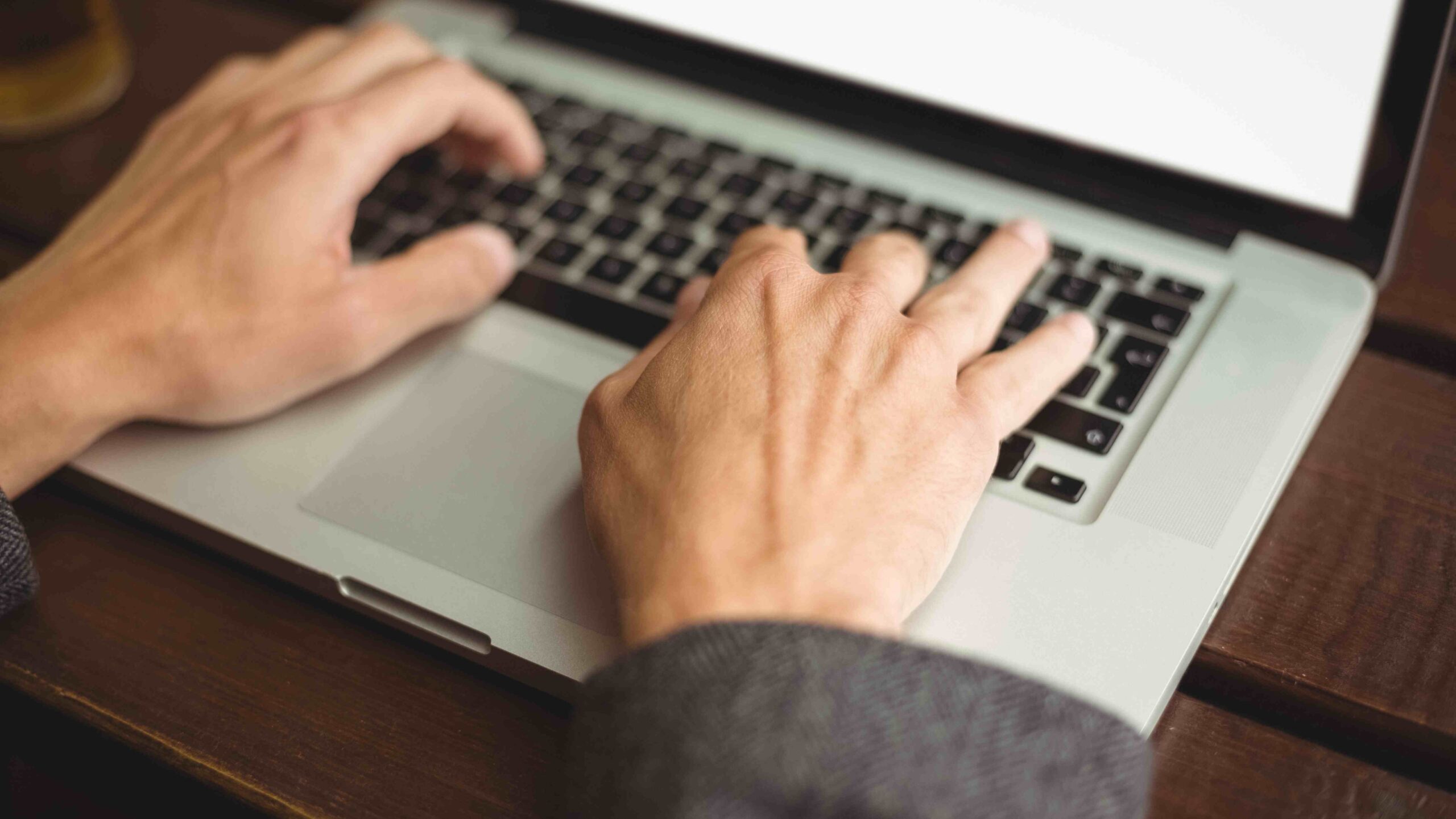 Man typing on computer