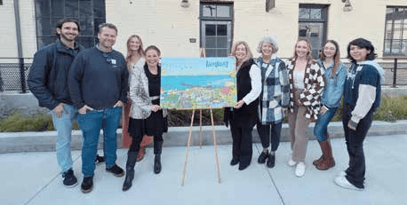 Visit Ventura staff with Dom McLeod, the designer and illustrator of this year’s cover art.