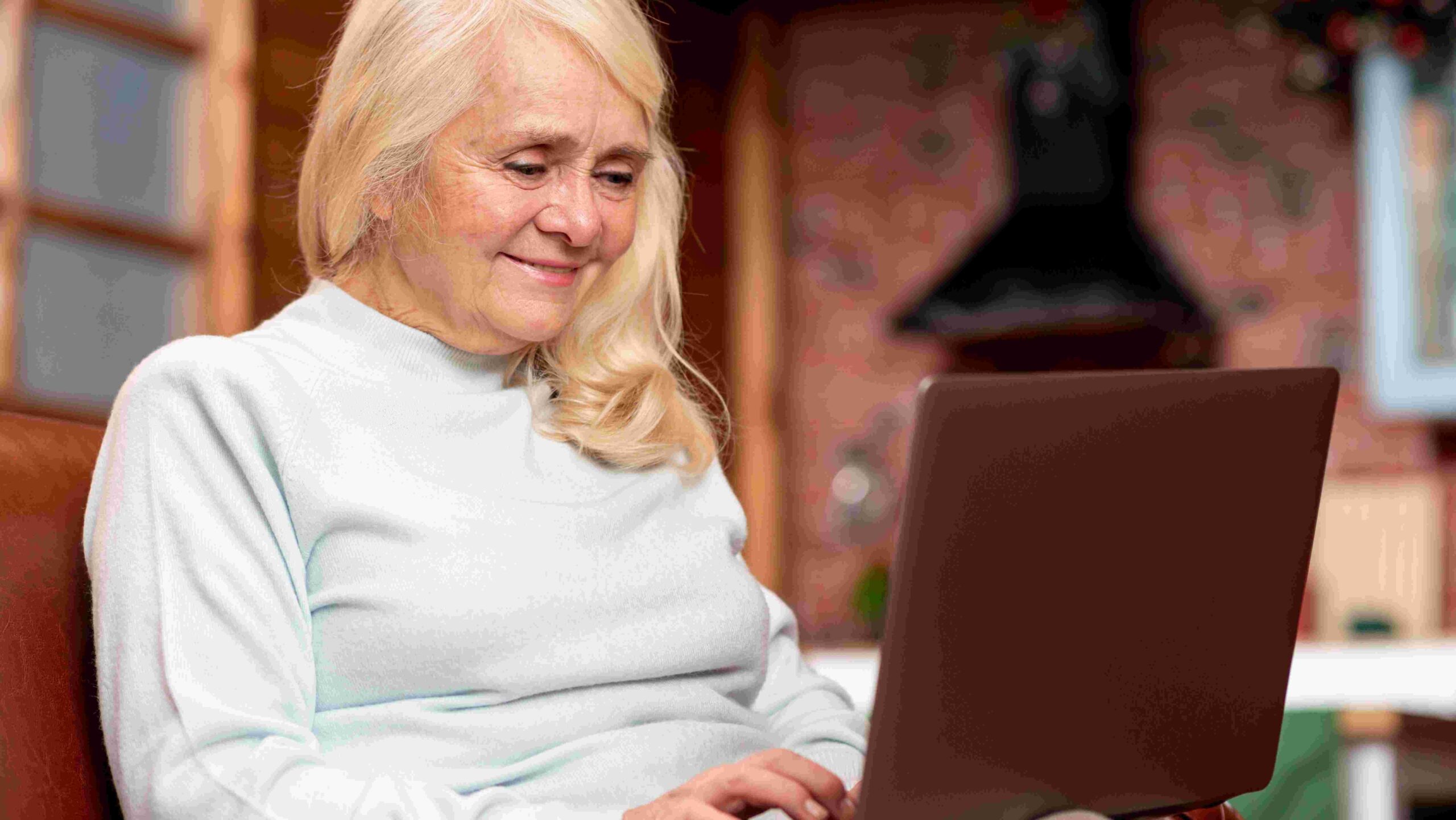 Senior woman using laptop computer