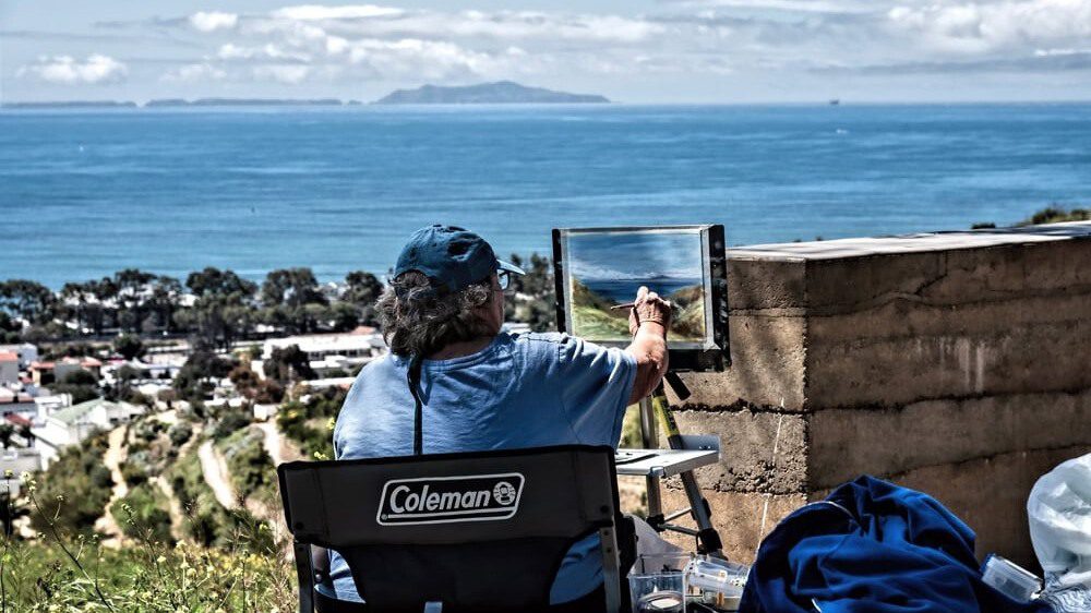 An artist paints en plein air along the garden trails during the annual Paint Out at Ventura Botanical Gardens.