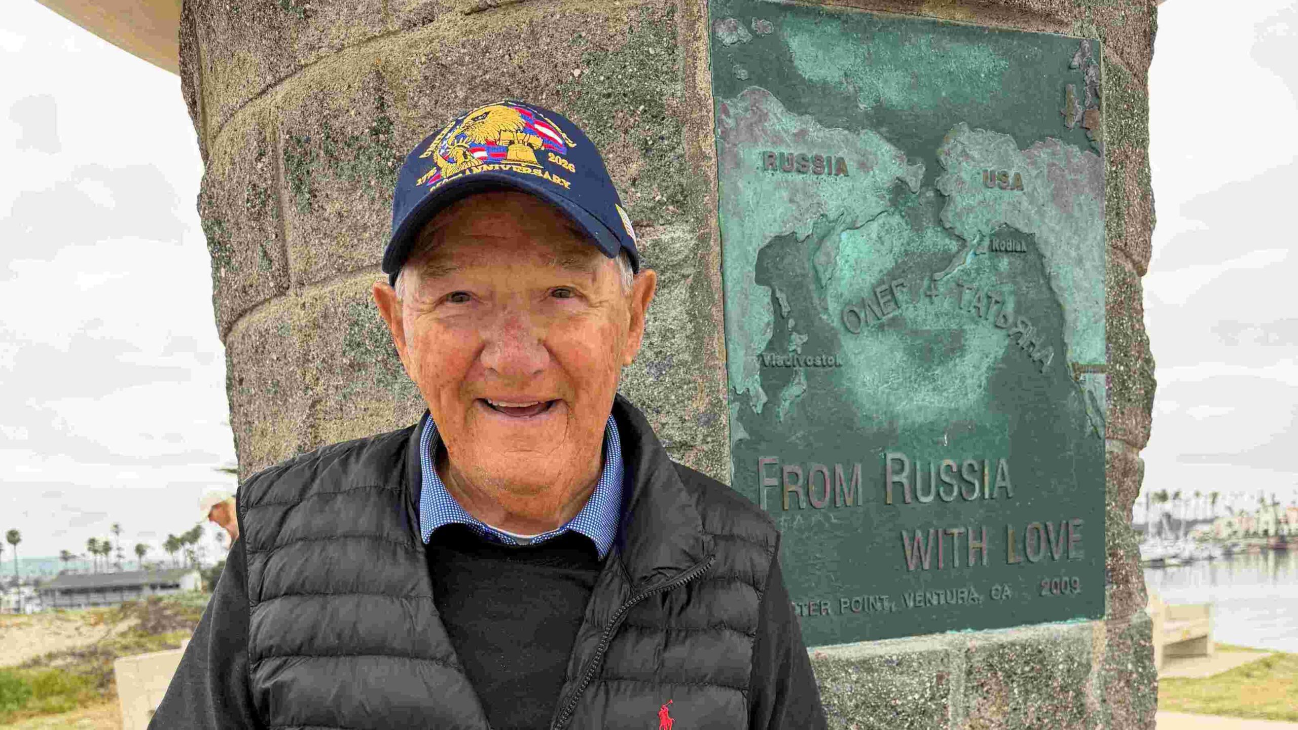 Photo of Andy in front of statue.