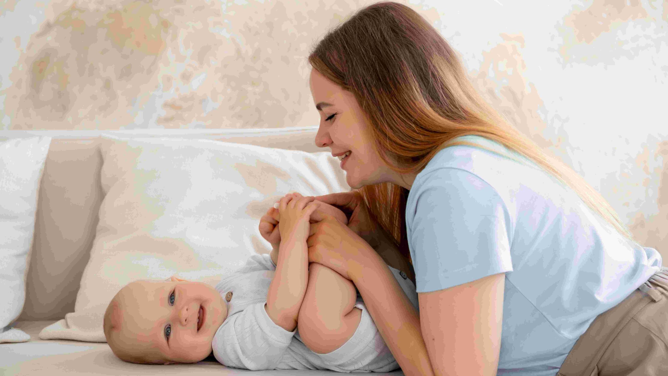 Mother playing with baby