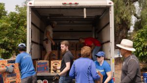 Volunteers loading truck at Zest Fest