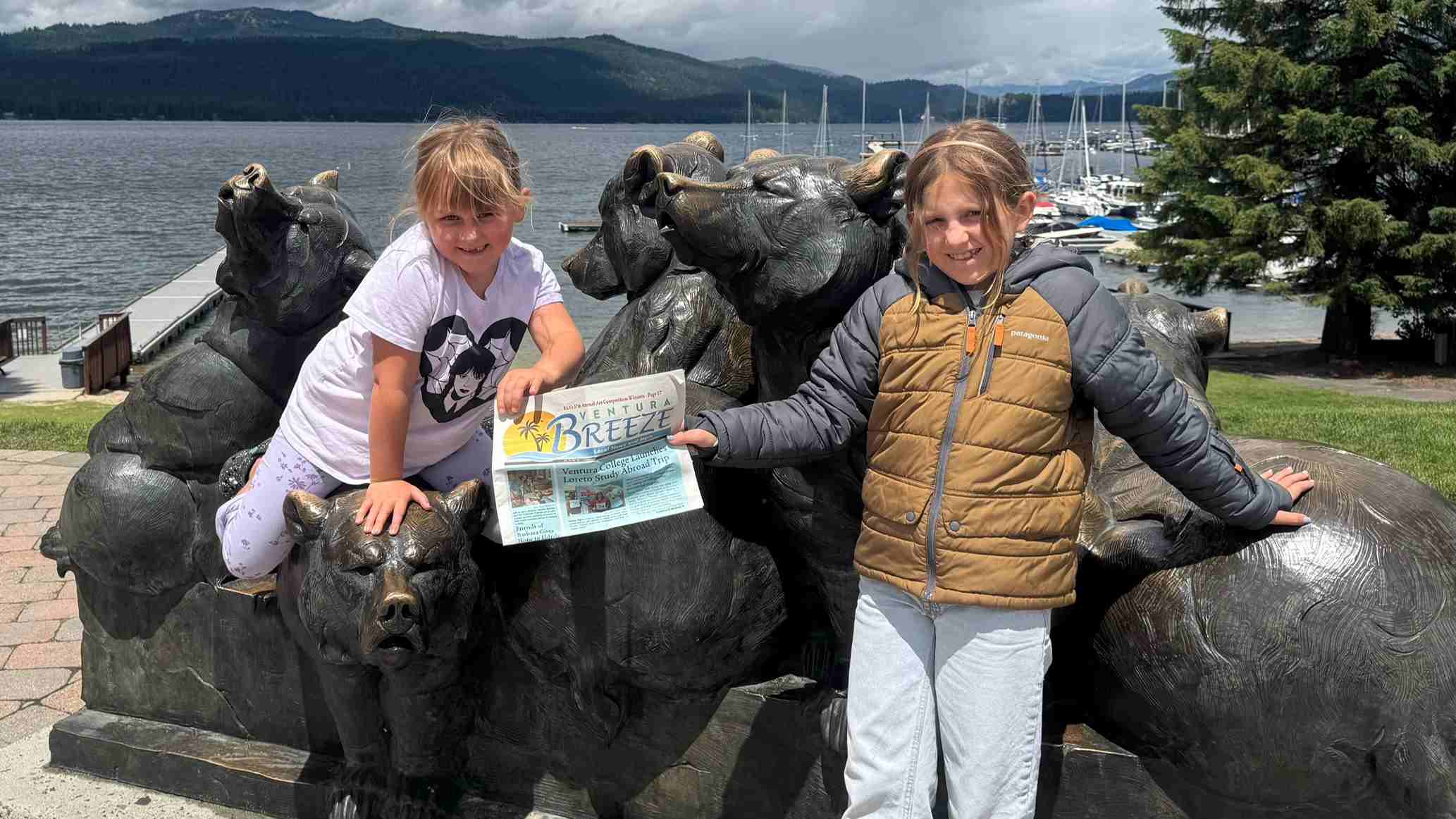 Photo of the kids holding paper.